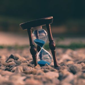 Hour glass with blue sand